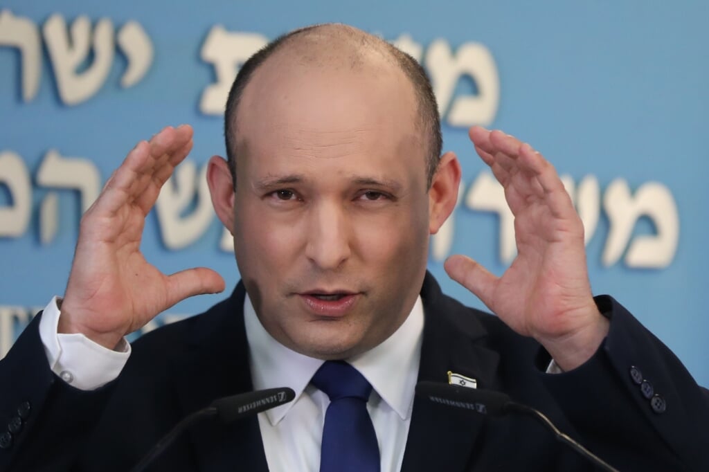 2021-08-18 18:35:28 epa09419356 Israeli Prime Minister Naftali Bennett speaks during a media briefing on COVID-19 pandemic status in the country at the Prime minister's office in Jerusalem, Israel, 18 August 2021. Bennett said the government is expected to approve administering a third dose of coronavirus vaccine to people over 40 years old.  EPA/ABIR SULTAN / POOL