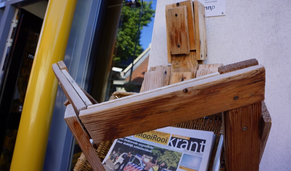 De kenmerkende houten pop voor ons kantoor.