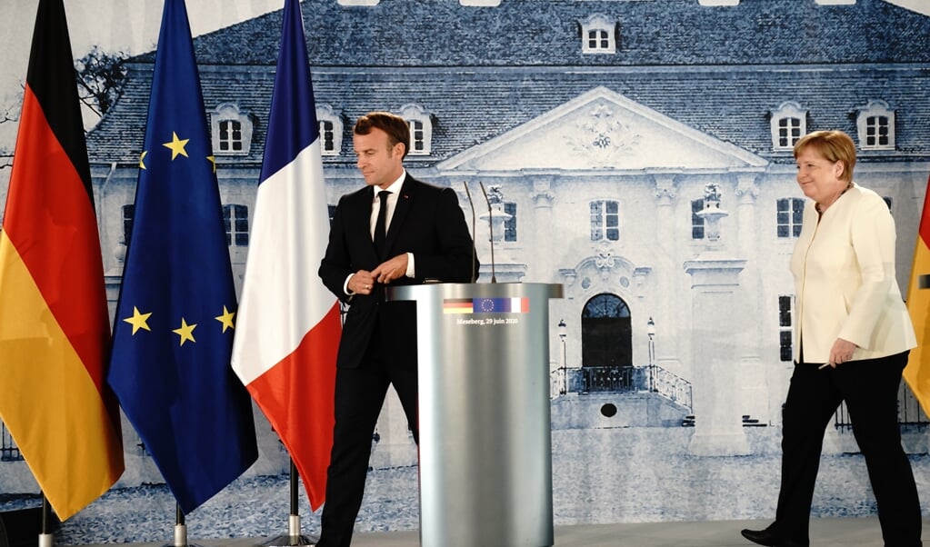 Macron spreekt graag beeldend en met grote woorden. Merkel is saai, technocratisch, maar uiteindelijk solide en effectief. (beeld Kay Nietfeld / afp)