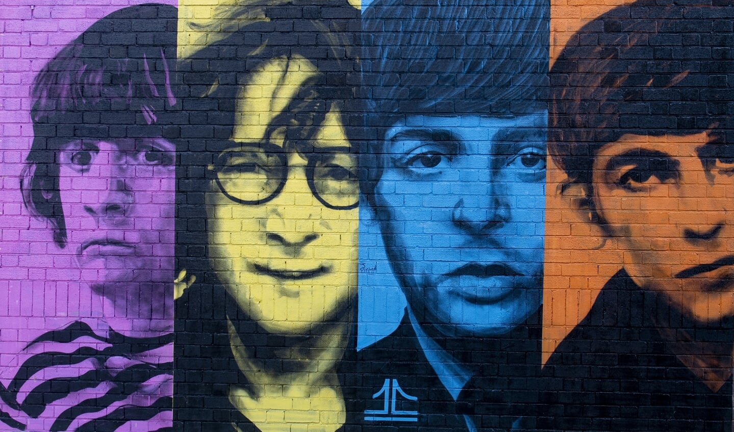 Een muurschildering van The Beatles in Liverpool.