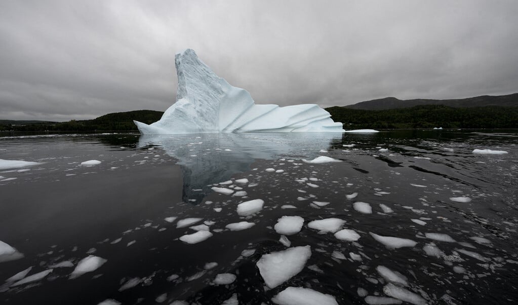 Door de opwarming van de aarde smelten gletsjers.  (beeld afp / Johannes Eisele)