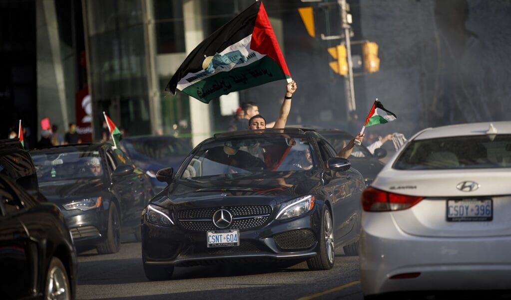Pro-Palestijnse jongeren reden door Canadese steden en belden aan bij woningen: 'Wonen hier Joden?' (beeld afp / Cole Burston)