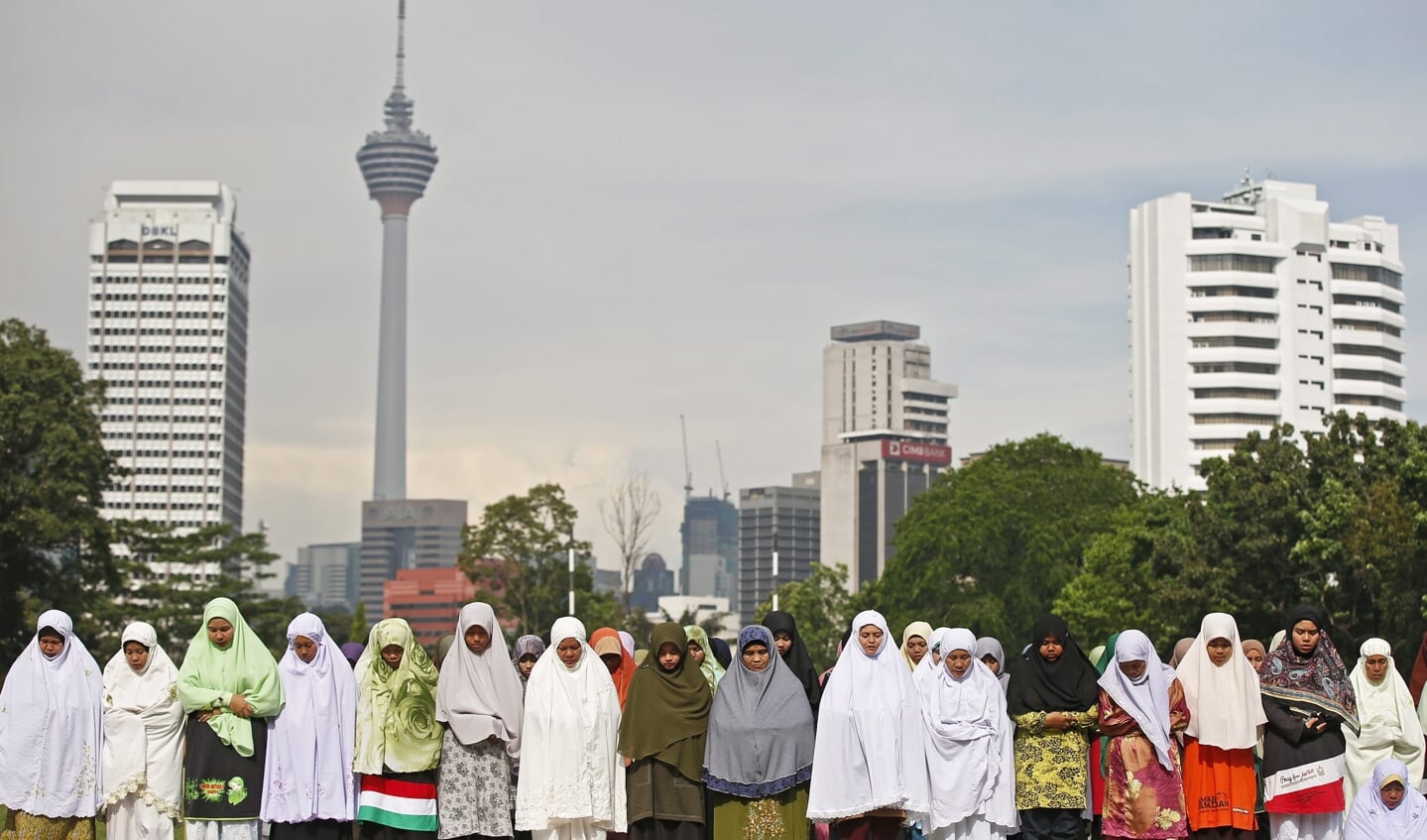 Aanhangers van de islamistische PAS-partij, die in Maleisië voorstander is van traditioneel shariarecht, bidden in Kuala Lumpur.