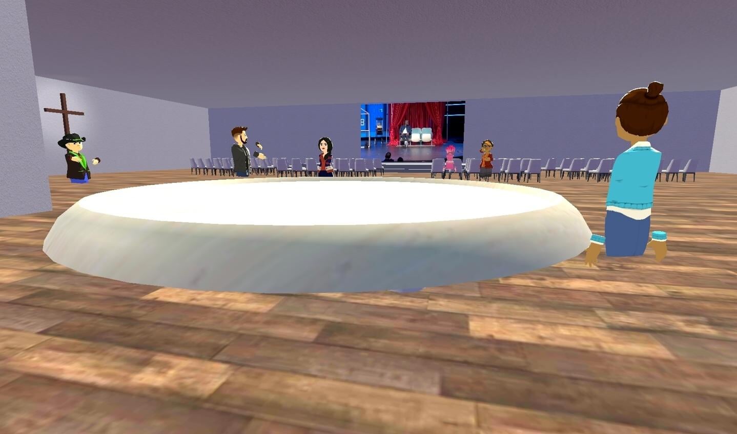 ... In de andere metaverse-kerk worden fragmenten van een preek getoond, waarna de avatars gespreksvragen bespreken rondom een grote, virtuele tafel.