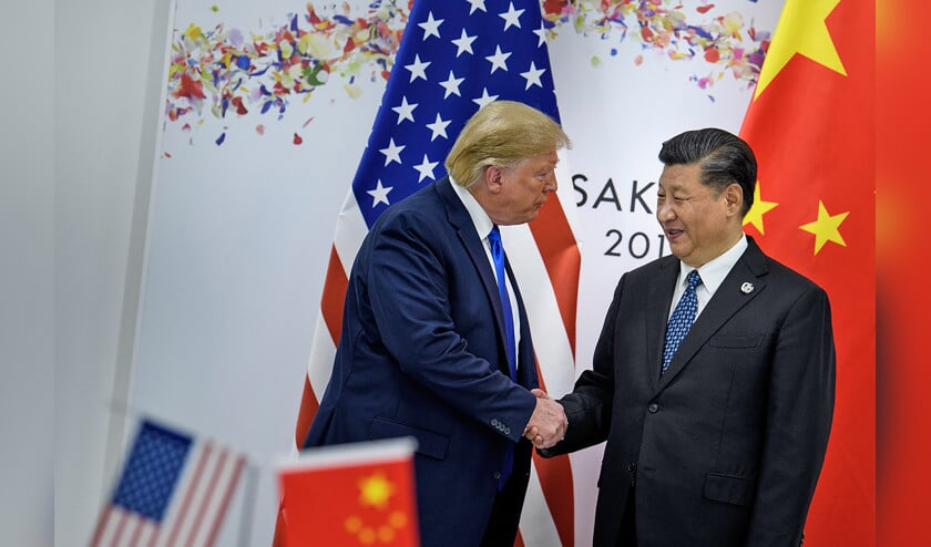 De Chinese president Xi en de Amerikaanse president Trump ontmoeten elkaar tijdens de G20-top in Osaka, eind juni. (afp / Brendan Smialowski)
