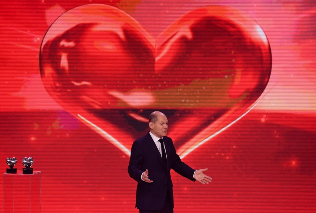 2021-12-04 23:16:02 Germany's Social Democrats Party (SPD) candidate for chancellor Olaf Scholz speaks on stage during the 