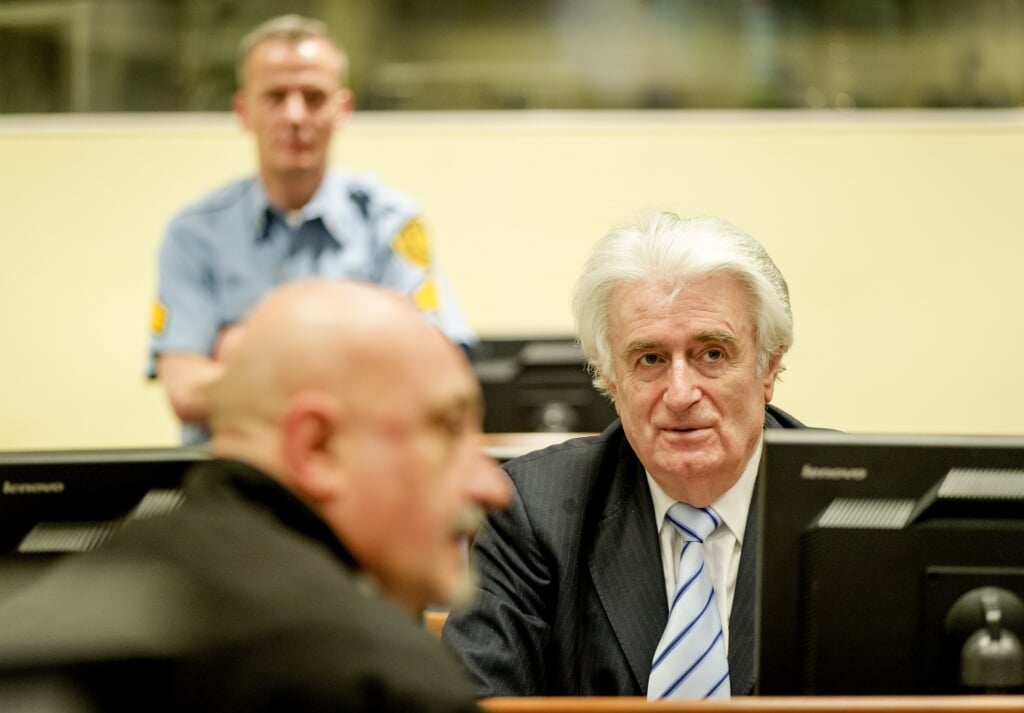 2016-03-24 13:46:36 THE HAGUE - Bosnian Serb wartime leader Radovan Karadzic in the courtroom for the reading of his verdict at the International Criminal Tribunal for Former Yugoslavia (ICTY) in The Hague, The Netherlands.The former Bosnian-Serbs leader is indicted for genocide, crimes against humanity, and war crimes. Karadzic is considered the main responsible for the Srebrenica. ANP POOL ROBIN VAN LONKHUIJSEN (beeld anp / Pool Robin van Lonkhuijsen)