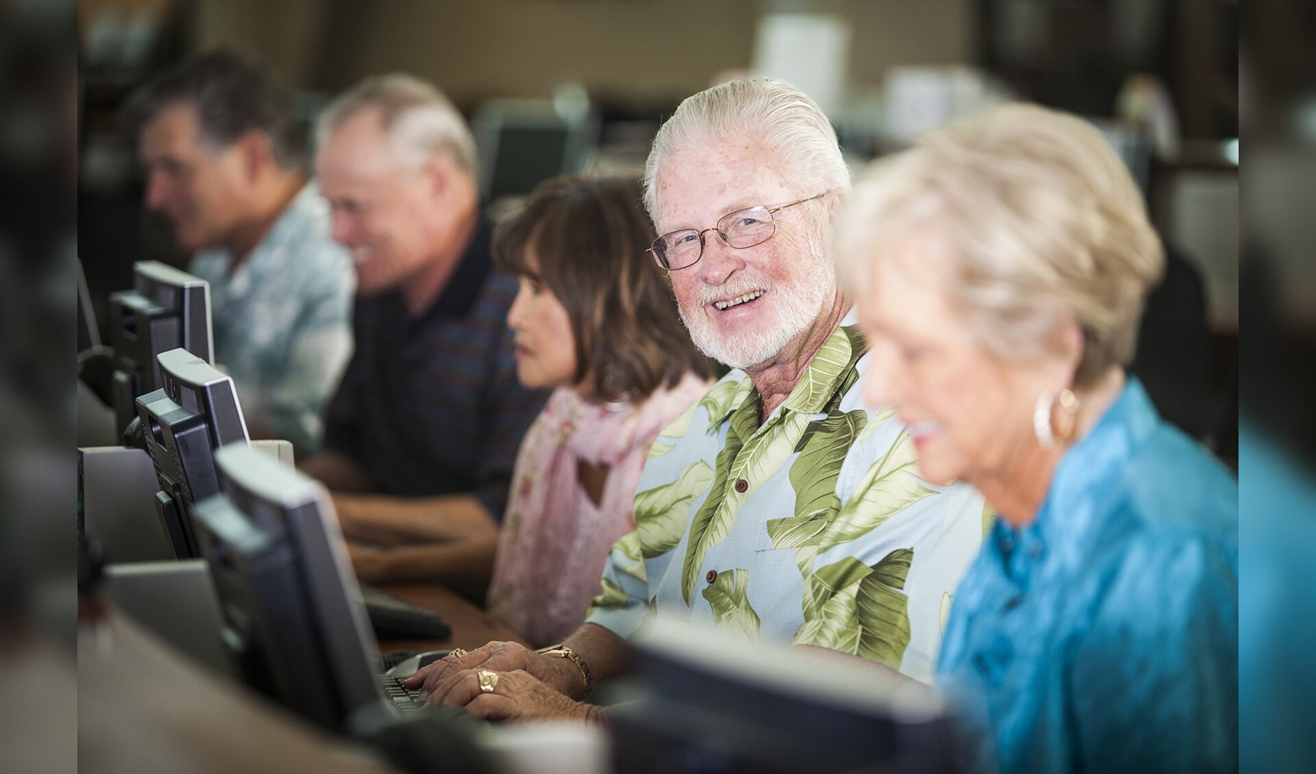 Attractive seniors using computers