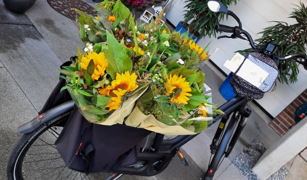 <p>op weg naar een Zonnebloem gast</p>