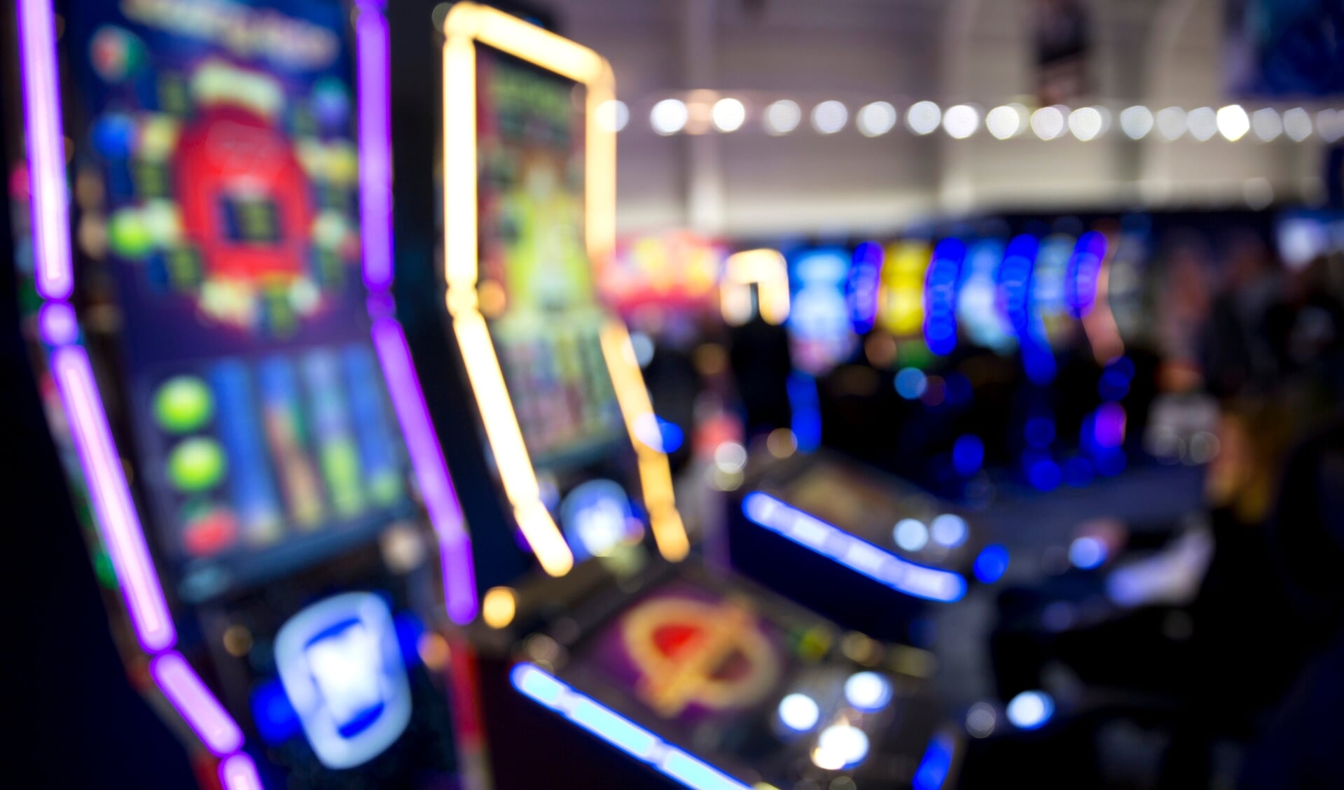 Blurred slot machines in a casino.