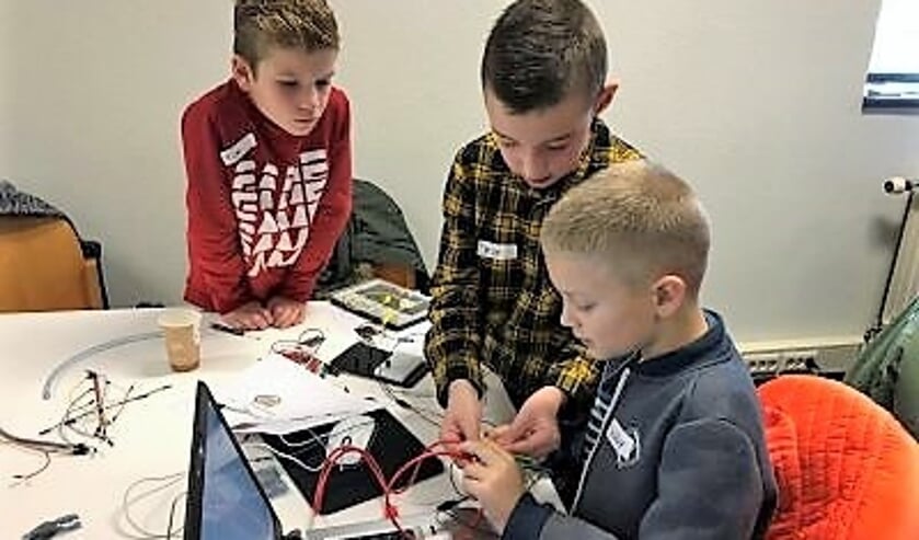 Tim, Jesse en Sebby (v.l.n.r.) bij de CoderDojo