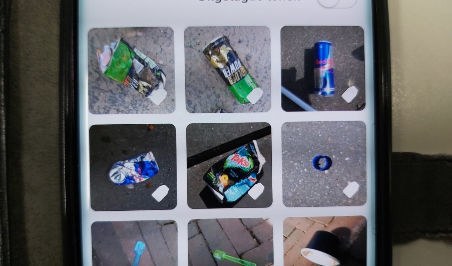 Op m'n telefoon toont Litterati een deel van het opgeruimde vuil.