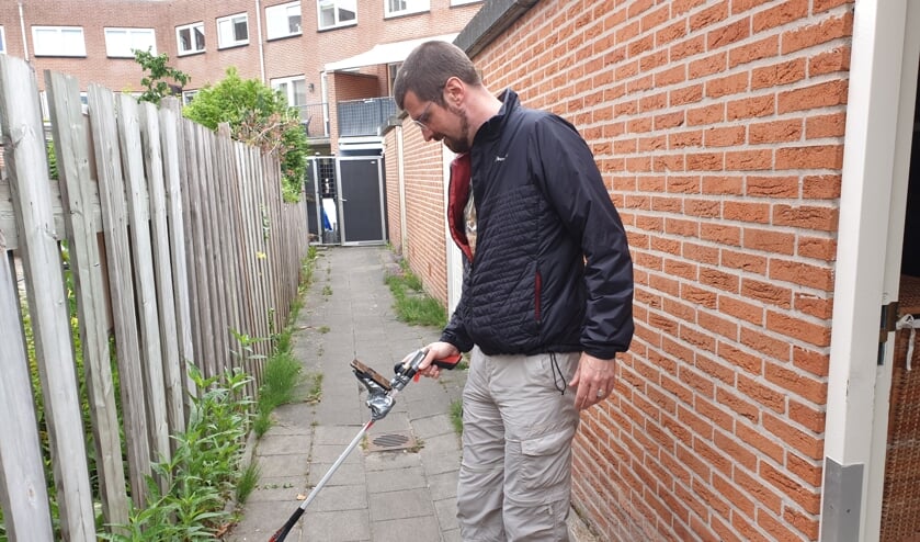 Marco Meerman en zijn grijpstok annex camera.