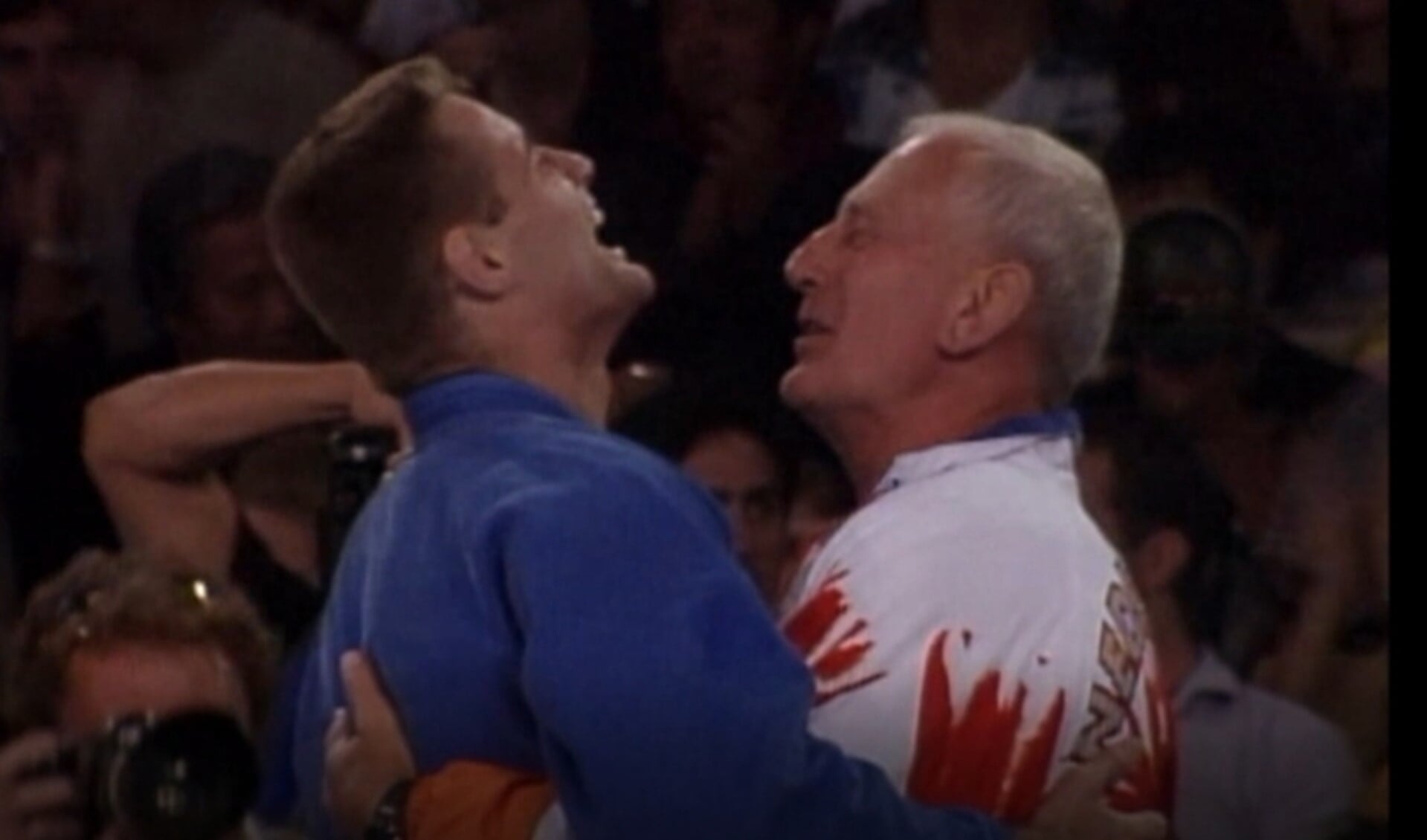 Mark Huizinga en coach Chris de Korte meteen na de Olympische finale.
