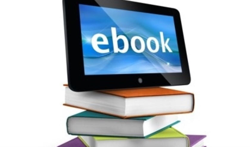 stacked books with a tablet on top
