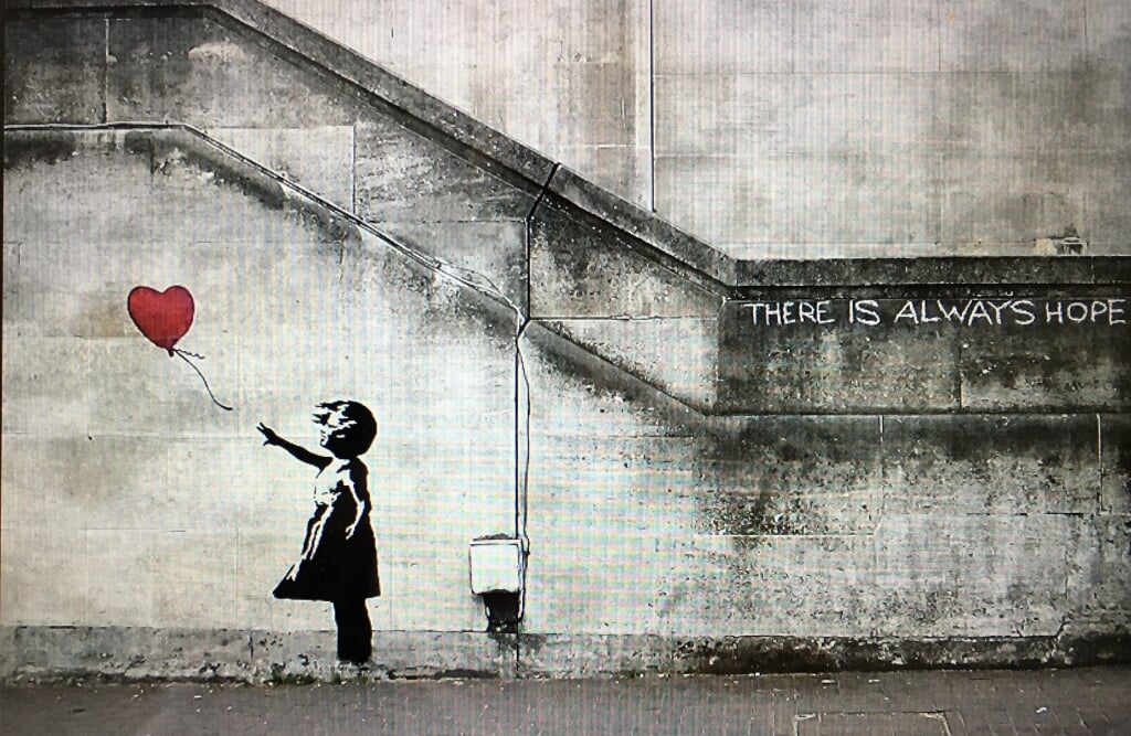 Girl with balloon van straatkunstenaar Banksy. | Foto: PR 