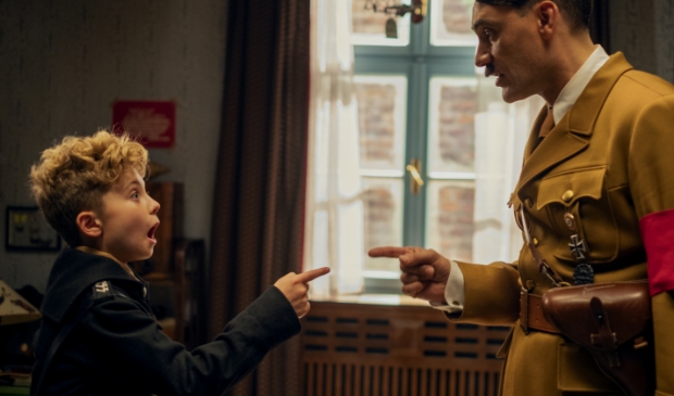 <p>Roman Griffin Davis and Taika Waititi in the film JOJO RABBIT.</p>